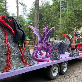 Large colorful dragon statues on a float.