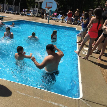 Children playing in a pool.