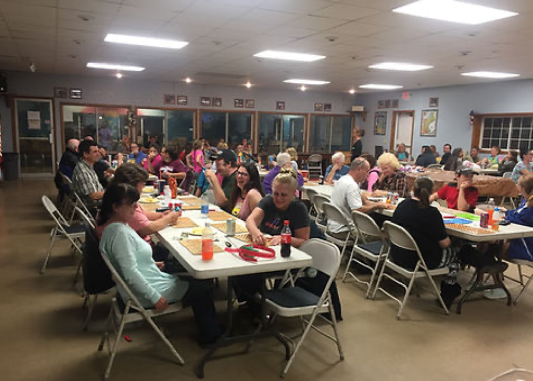Campers playing bingo inside the recreation hall
