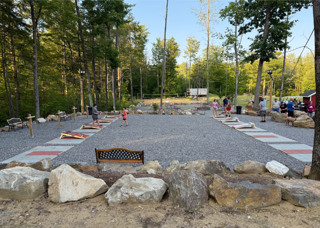 Outdoor aread with multiple cornehold boards.