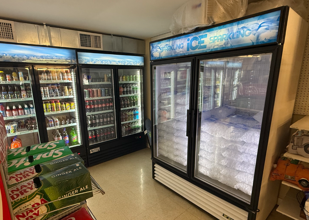 Coolers with drinks and bagged ice.