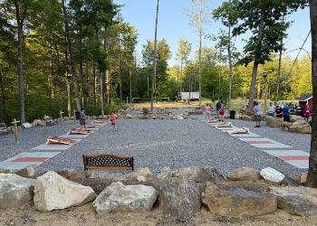 An area with multiple cornhole boards.